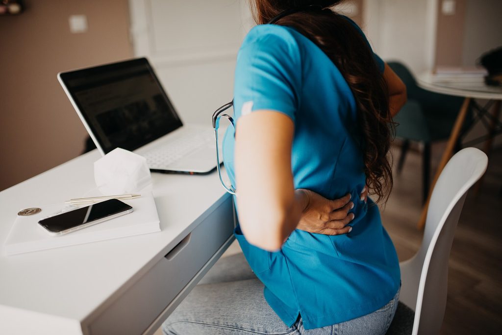 The Hybrid Compromise Is Winning the Office Wars A person working from home at a desk with a laptop